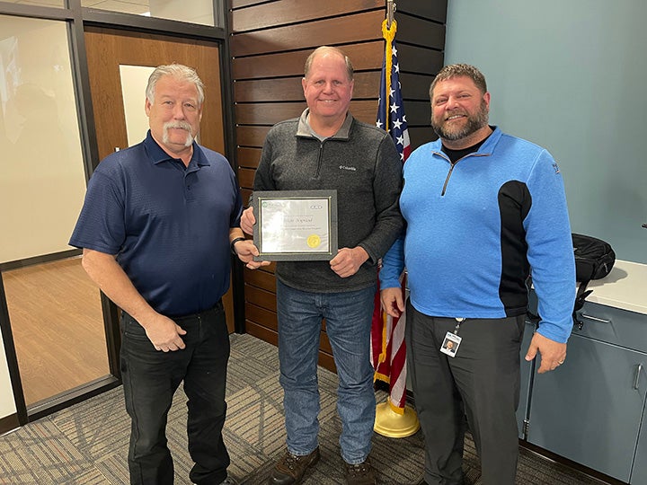 Brian Napstad accepting certificate